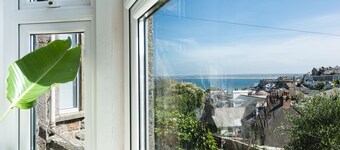 Treloweth, a large family home with sea views, parking and outside space, free WifI.