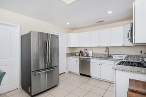 Microwave, dishwasher, coffee/tea maker, cookware/dishes/utensils