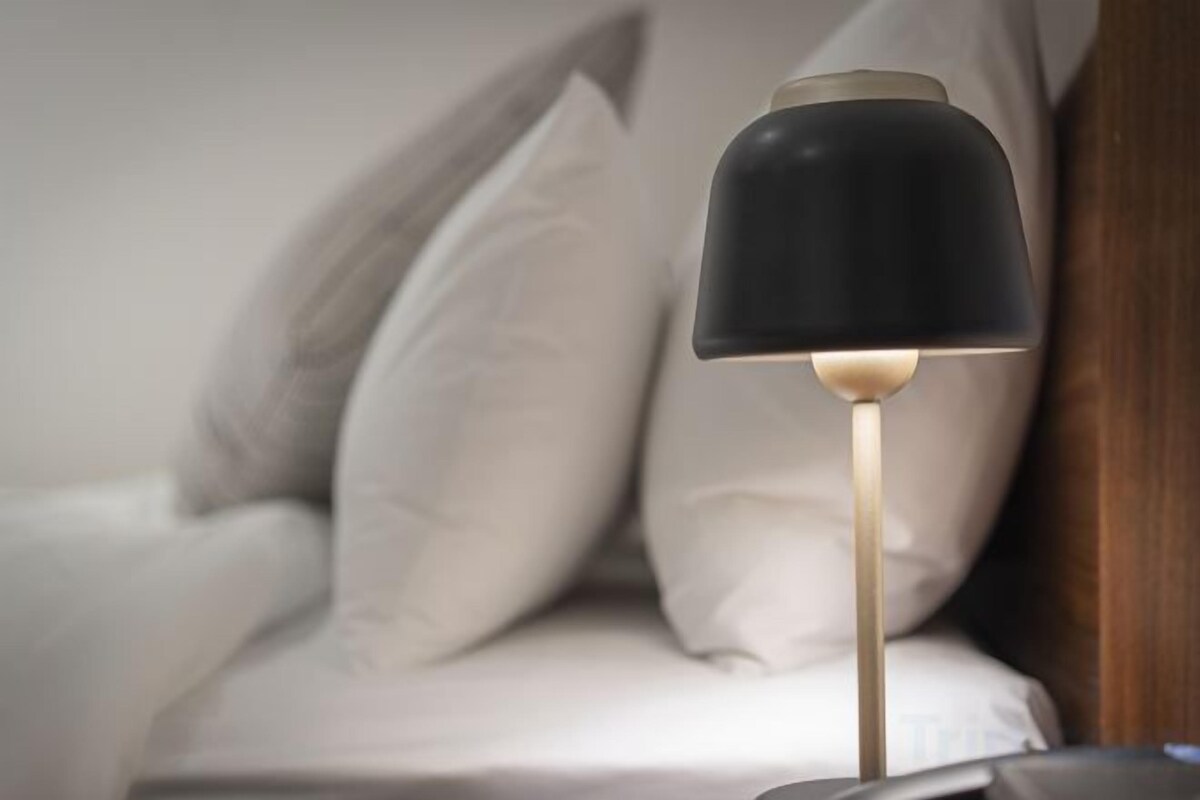 Premium bedding, desk, laptop workspace, soundproofing