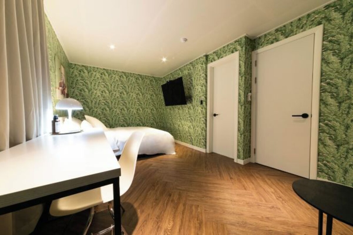 Premium bedding, desk, laptop workspace, soundproofing