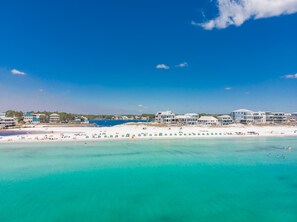 A coastal hotel with multiple buildings, a beach, and clear turquoise waters. - Steps to the White Sand & Emerald Gulf Coast ~ Heated Pool ~ Tennis•Pickleball  (Santa Rosa Beach)