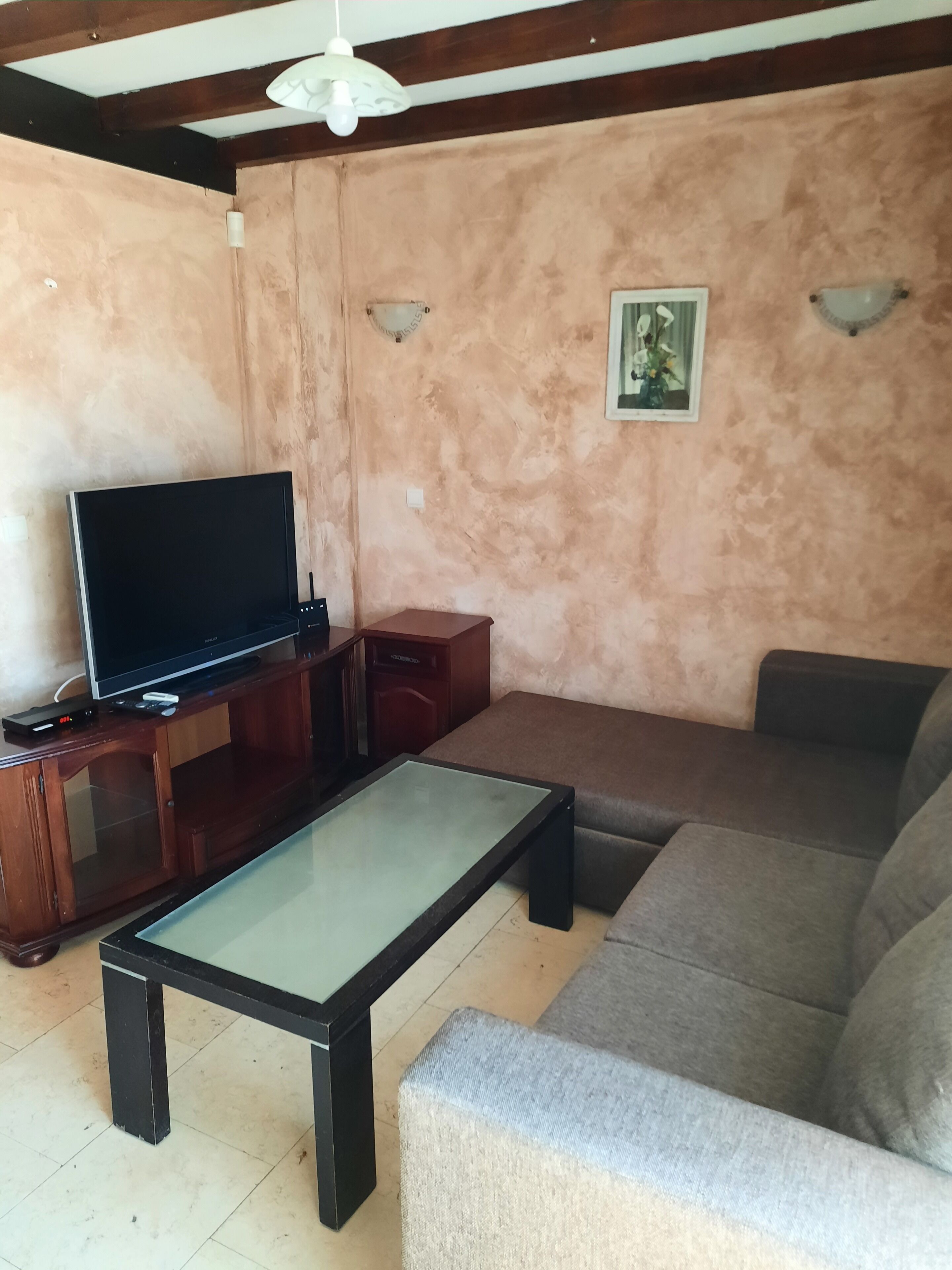 Villa | Living room | 30-inch TV with cable channels, fireplace