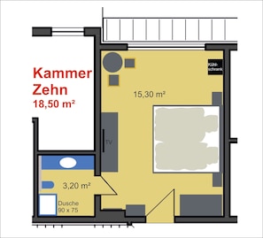 A hotel room layout with a TV, a small bathroom, and a kitchenette area.
