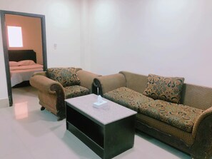 Family Apartment | Living area | 32-inch LCD TV with cable channels, TV - Al Khobar Plaza (Manama)