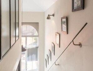 Corridors lead to a variety of rooms, offering a glimpse into the property's history.