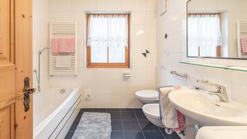 Bathtub, hair dryer, towels