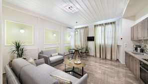 Executive Suite, 1 Bedroom, Non Smoking, Ground Floor | Private kitchen | Cookware/dishes/utensils, cleaning supplies, paper towels
