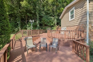 A wooden deck with outdoor furniture and a brick house in the background. - Mill Creek Guest-Suite Nolensville-Brentwood, Tn (Nashville)