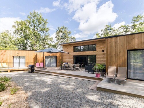 Spacious Modern Wooden House with Large Park, Terrace, and Game Amenities