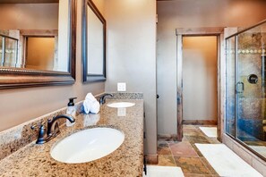 Combined shower/bathtub, hair dryer, towels, soap
