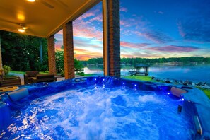 A hot tub with a view of a lake and sunset. - Pathway Bay (Mooresville)