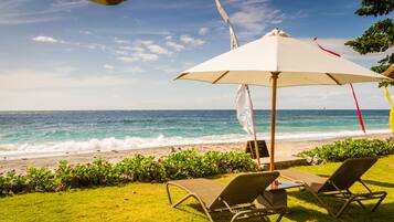On the beach, sun-loungers, beach umbrellas, beach towels
