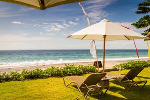 On the beach, sun loungers, beach umbrellas, beach towels - Aquamarine Beach Villas (Karangasem)