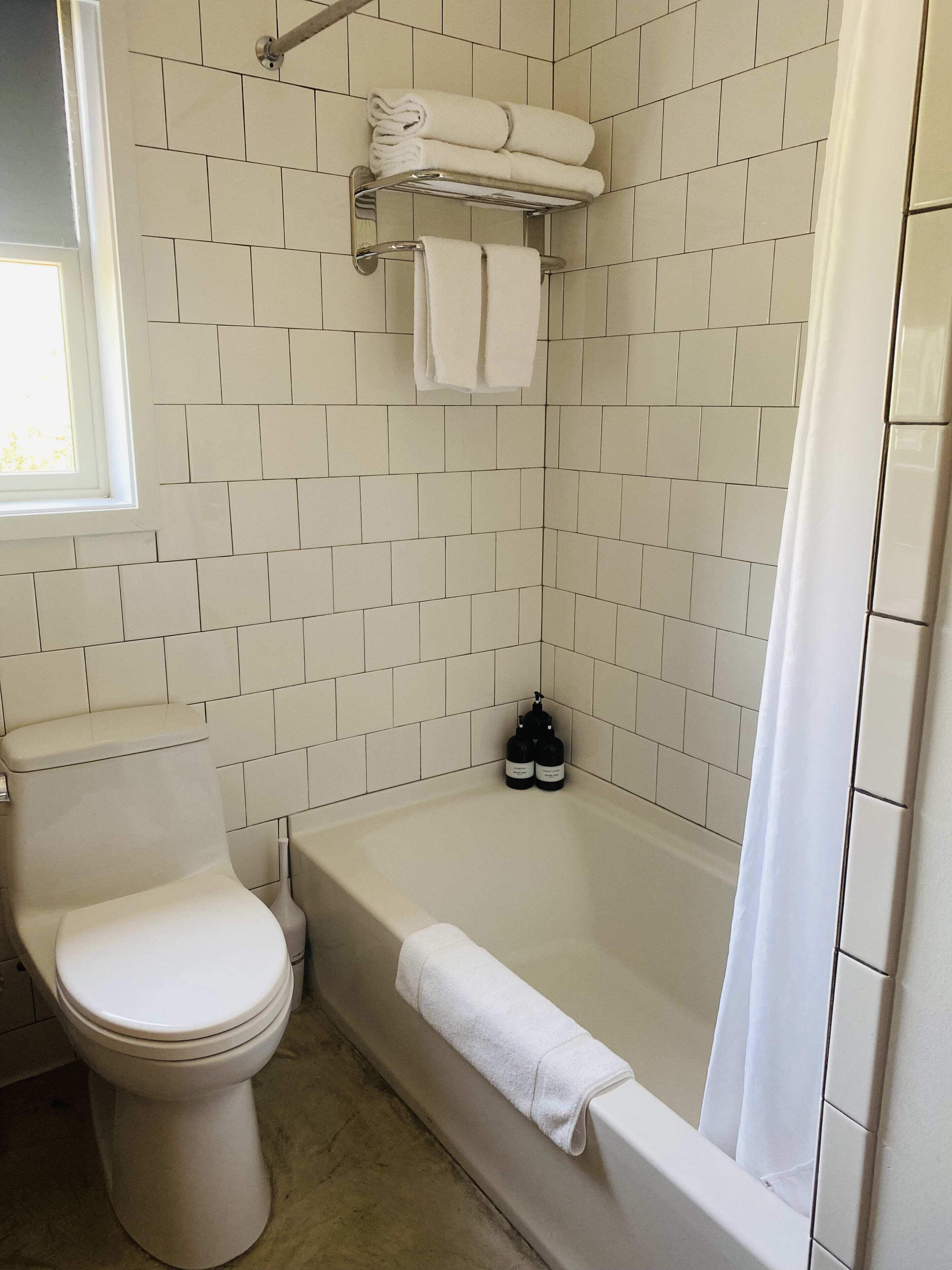 Bathtub, hair dryer, towels