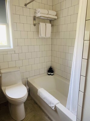 Bathtub, hair dryer, towels