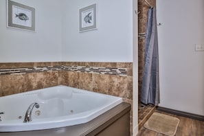 Bathtub, jetted tub, hair dryer, towels