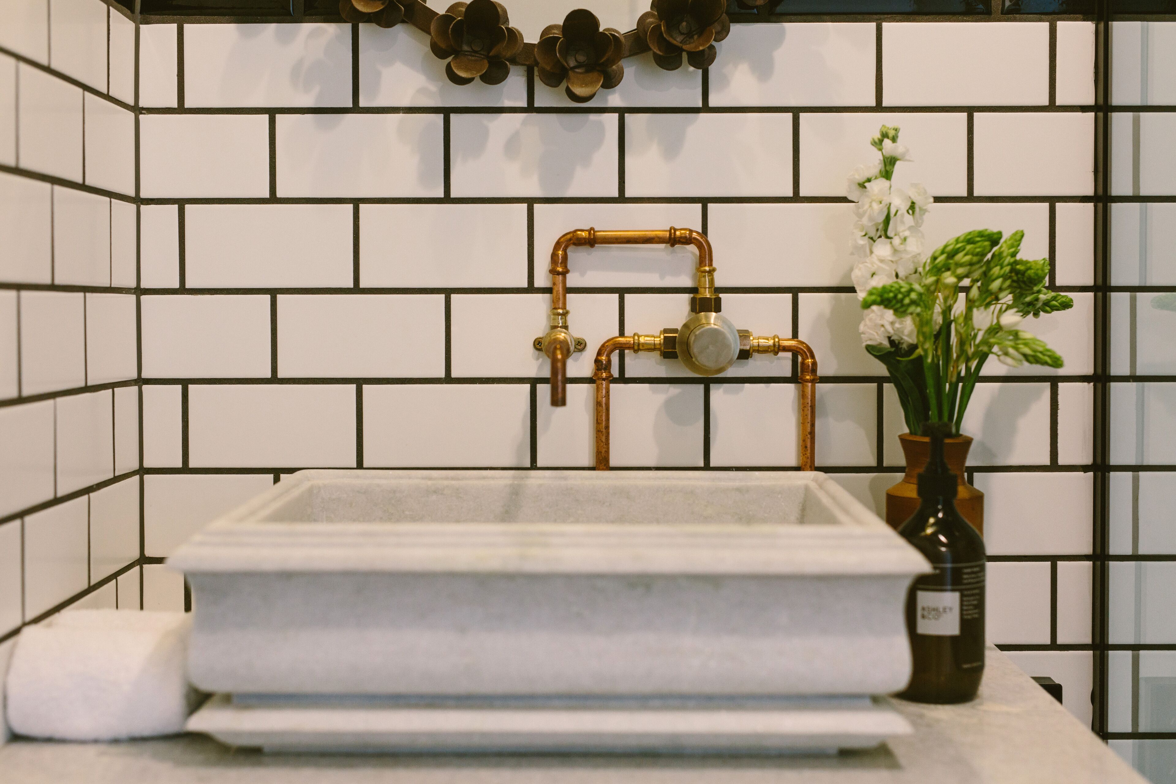 designer toiletries, hair dryer, towels, soap