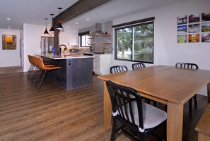 Enjoy meals in the spacious kitchen with a stove and ample counter space, perfect for casual dining.
