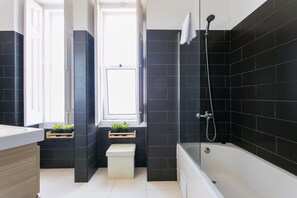 Bathtub, hair dryer, towels