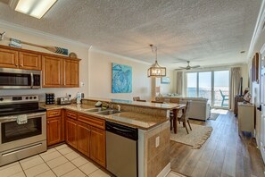 Enjoy meals in the kitchen with a sink, microwave, oven, and dishwasher, and dine with a view of the ocean.