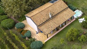 A two-story house with a tiled roof, a covered patio, and a swimming pool. - Alghero magnificent villa Laurus with pool in Valverde 122 D (Alghero)