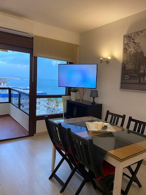 Enjoy meals in this dining area with a large table, comfortable chairs, and a flat-screen TV.