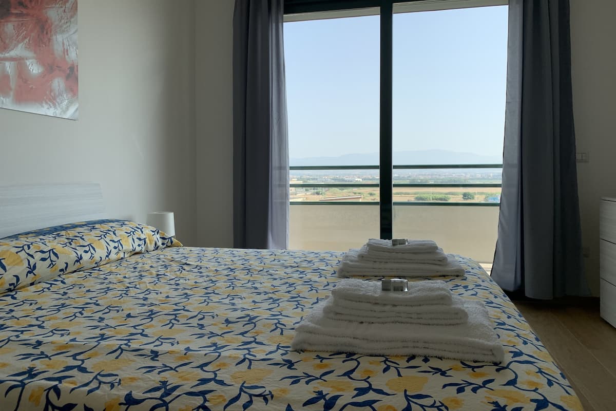 Panoramic Condo, 1 Bedroom (Golfo) | 1 bedroom, down comforters, iron/ironing board, WiFi (free)
