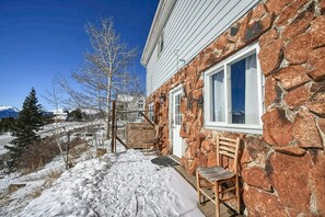 a cozy, stone-exterior house covered in snow - The Hilltop Suite — Mt Massive Views | Pet OK | EV Charger | Sleeps 4 (Leadville)
