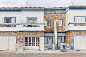 A multi-story building with a stone facade, blue trim, and white shutters. - Villa with WIFI, shared pool 200m from the beach by AlgarveManta (1V4) (Manta Rota)