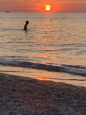 On the beach, sun-loungers, beach towels