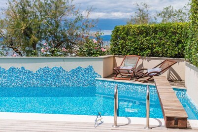 7-BR Beachfront Villa with Seaside Terrace and Heated Swimming Pool