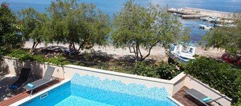 7-BR Beachfront Villa with Seaside Terrace and Heated Swimming Pool