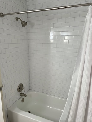 Combined shower/bathtub, hair dryer, towels, soap