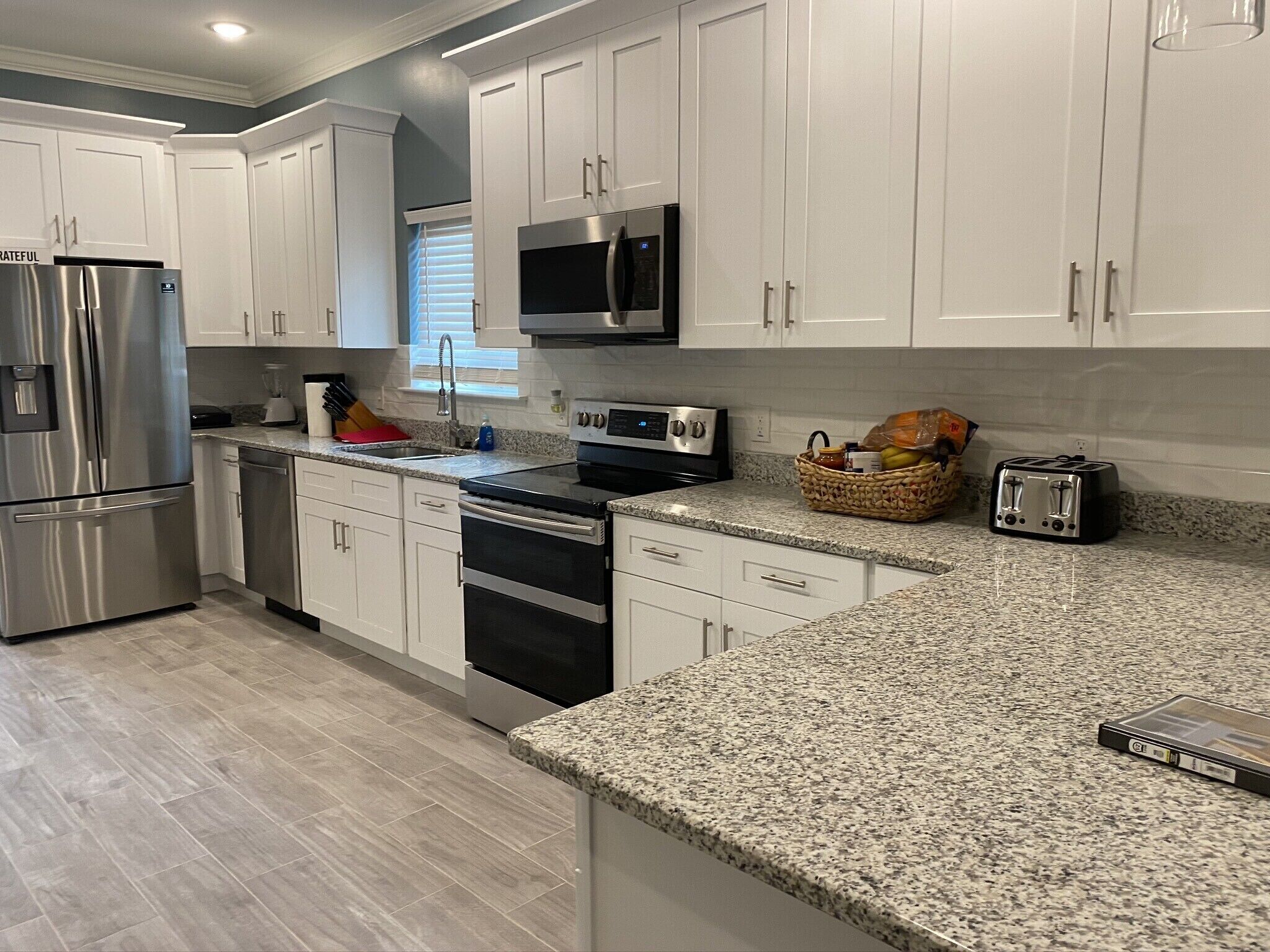 Another view of the kitchen - showing appliances and welcome basket with goodies