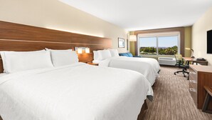 A hotel room with two beds, a desk, a chair, and a large window offering a view. - Holiday Inn Express & Suites Suisun City by IHG (Suisun City)