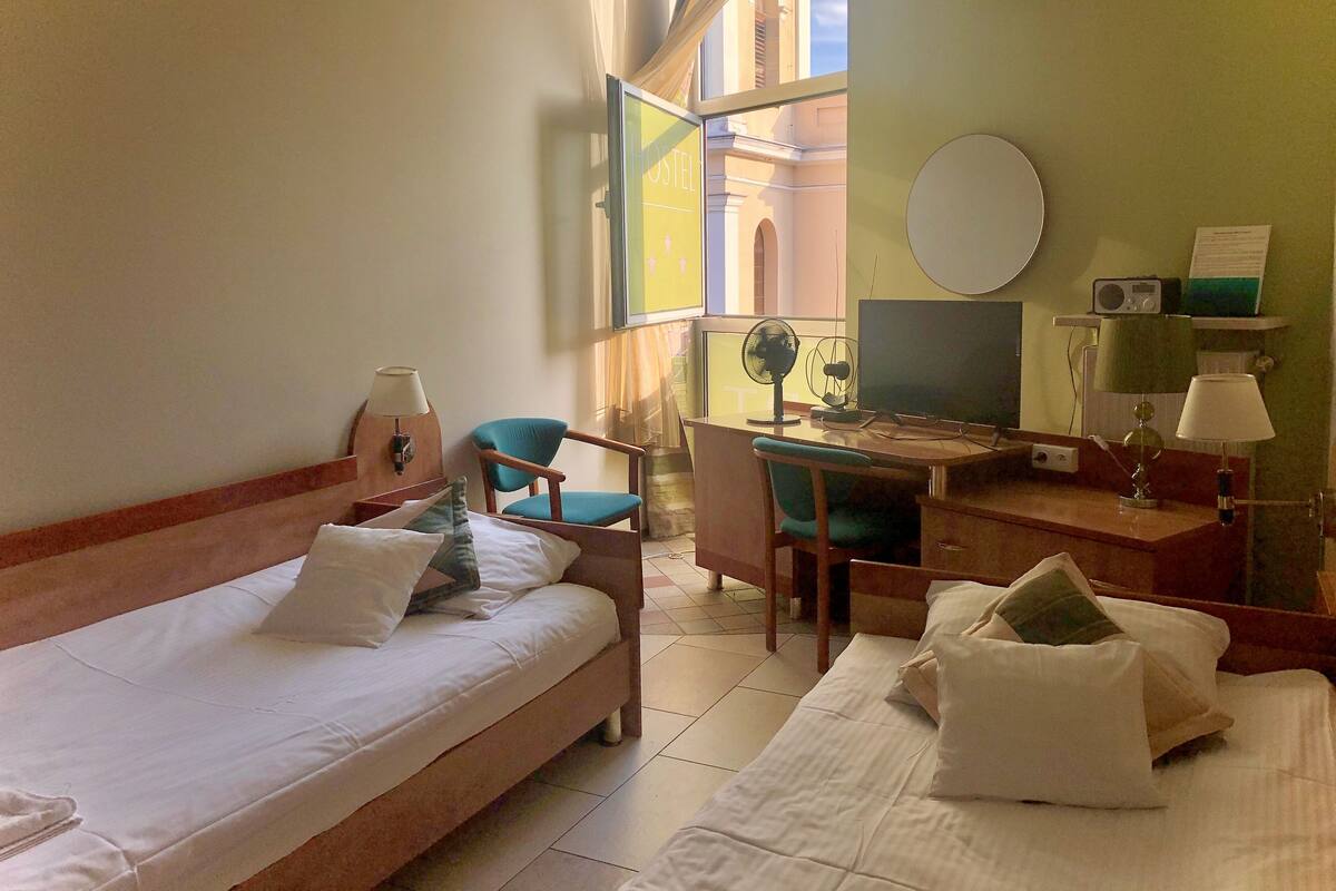 Desk, laptop workspace, free WiFi, bed sheets