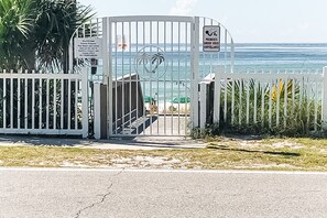 Secure entrance to a beachfront residence with ocean views.