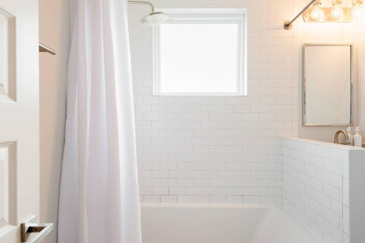 Bathtub, hair dryer, towels, soap