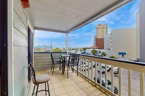 Relax on the balcony with a view of the cityscape.