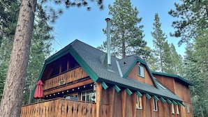 A cabin with a wooden exterior, a balcony, and a chimney. - Close drive to lake * Dog OK * Great Family Home (Carnelian Bay)