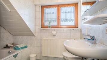 Bathtub, hair dryer, towels