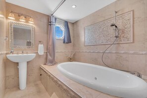 Combined shower/tub, hair dryer, towels, soap