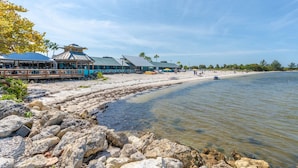 A beachside restaurant with outdoor seating and a view of the ocean. - Waterfront 2BR Townhome w/ 4 Balconies, Views of River, Bay & St. Pete – Near Beach & Pool (Ruskin)