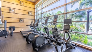 A gym with treadmills, stationary bikes, and weight machines. - Waterfront 2BR Townhome w/ 4 Balconies, Views of River, Bay & St. Pete – Near Beach & Pool (Ruskin)