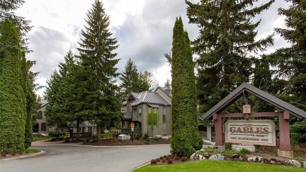 A residential area with a sign for 'The Gables' at 4610 Blackcomb Way.