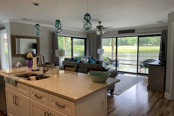 Living room with view of lake and golf course