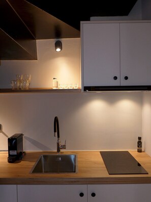 Fridge, coffee/tea maker, electric kettle, cookware/dishes/utensils