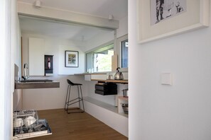 Fridge, stovetop, dishwasher, coffee/tea maker