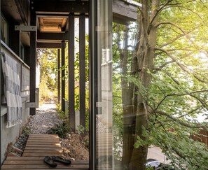 Stroll along the winding pathway to a serene retreat, surrounded by lush greenery and natural beauty.