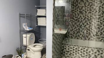 Combined shower/tub, hair dryer, towels, soap